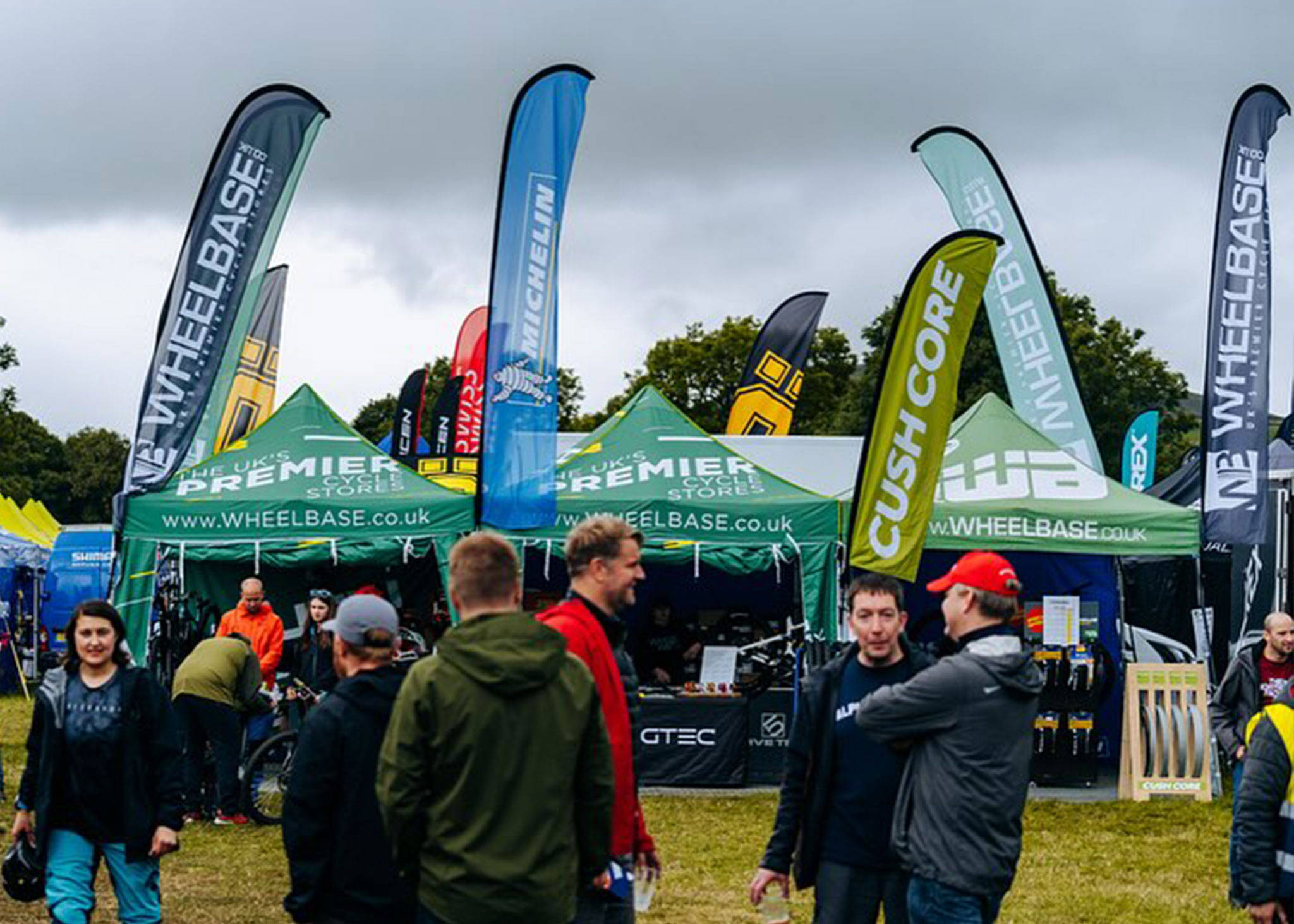 custom branded flags on wheelbase gazebos