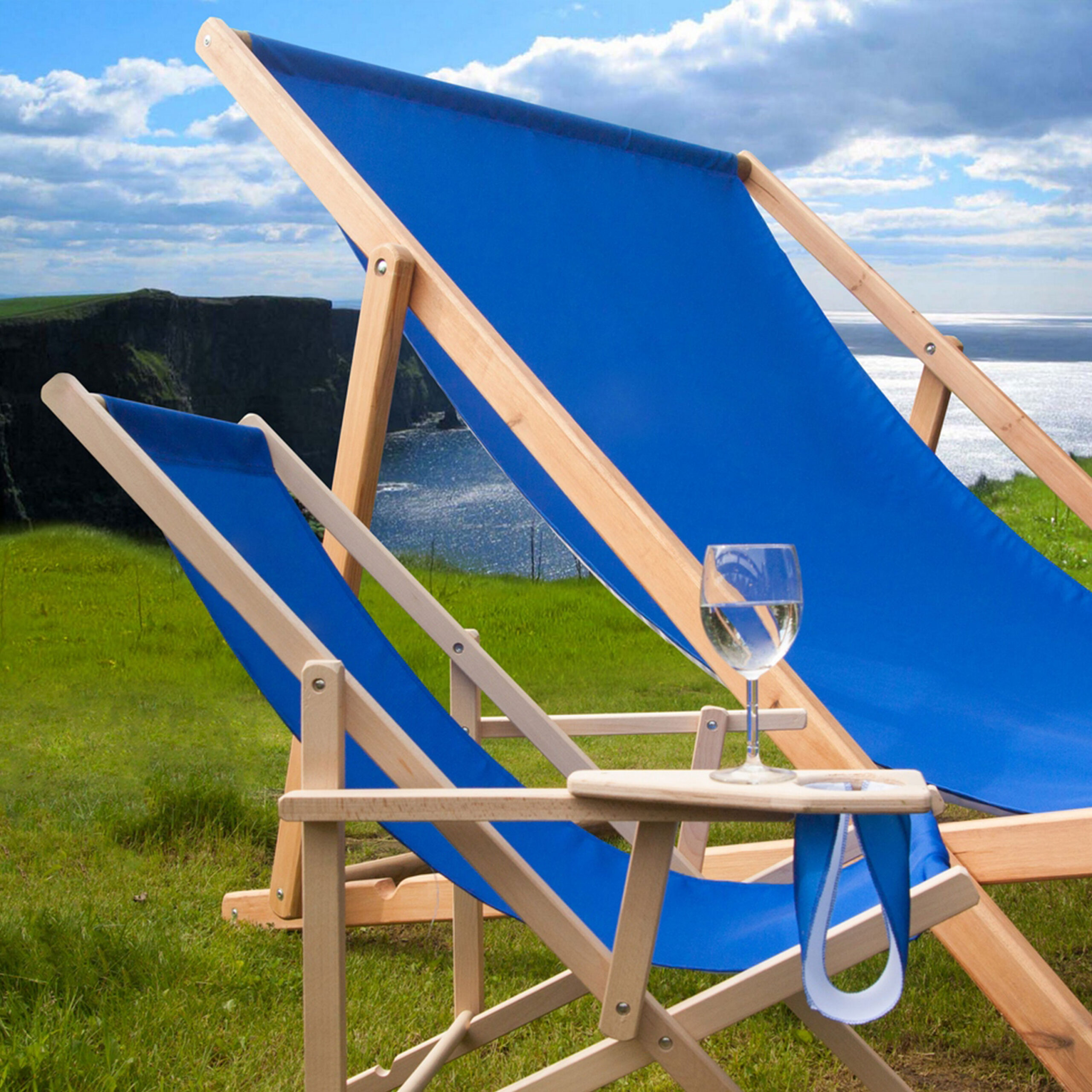 a blue Giant Deckchair placed next to a normal sized deckchair to showcase its huge size